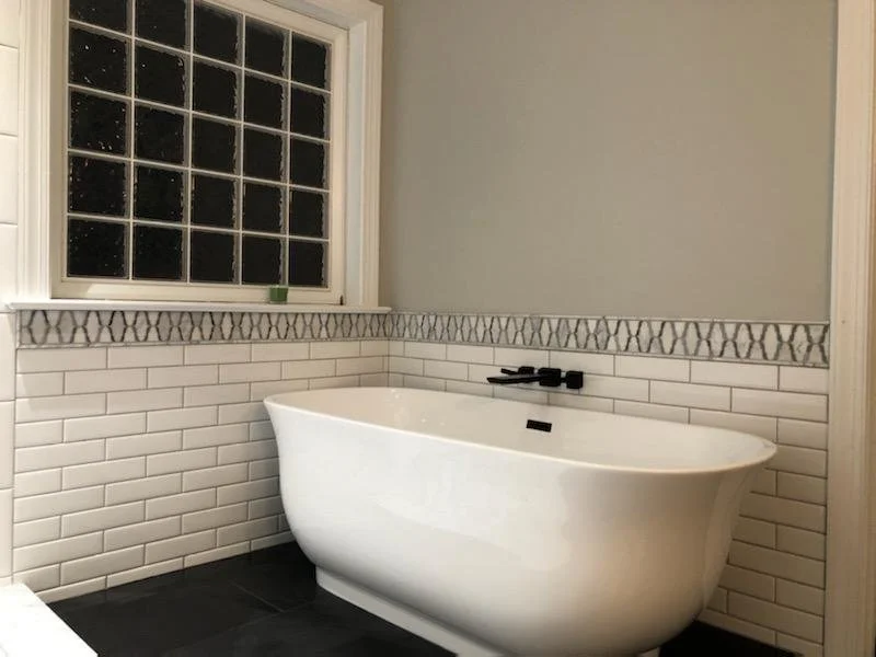 Bathroom renovation, Apex NC. Custom tile, new fixtures, and vanity installation.