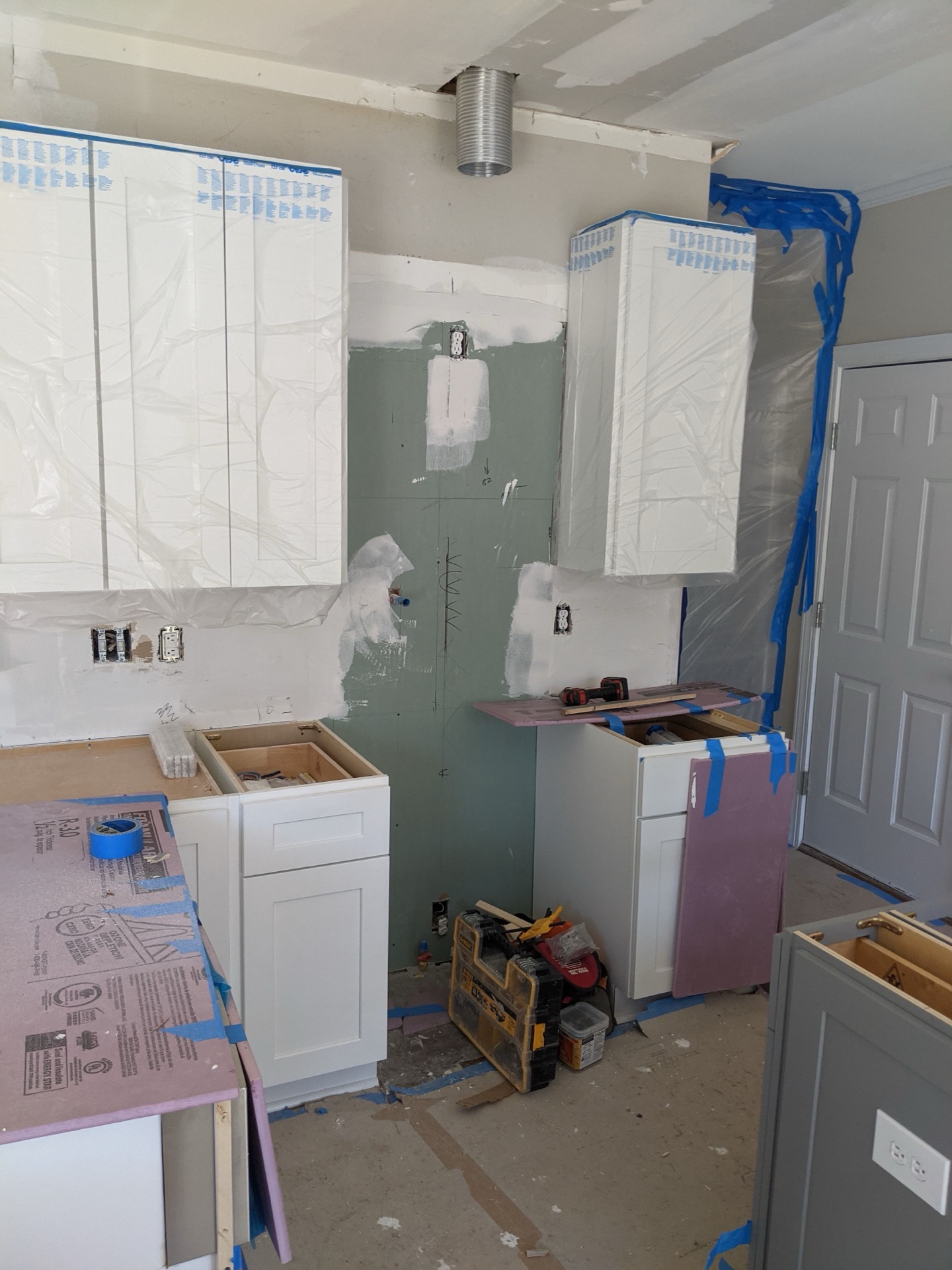 Kitchen cabinet installation, Cary NC. Cabinet layout, countertop coordination.