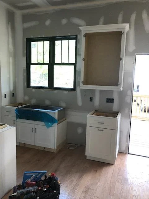 Kitchen renovation, Garner NC. Updated cabinets, backsplash, and hardware throughout.